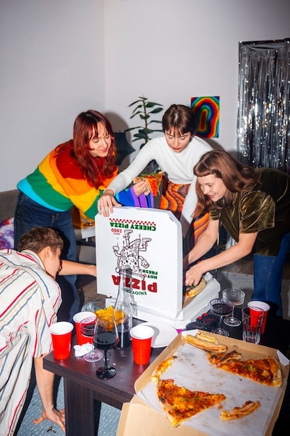A group of spectators holding signs supporting an LGBTQ+ League of Legends team at a live event. The signs feature messages of encouragement and allyship, emphasizing the importance of inclusive gaming communities.