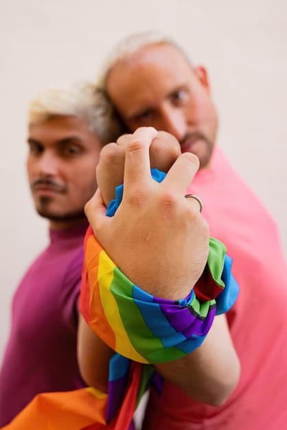 A photo showcasing members of the Riot Games LGBTQ+ ERG participating in a company-sponsored Pride parade. The image captures the group marching with pride banners and flags, highlighting their visibility and support within the company.