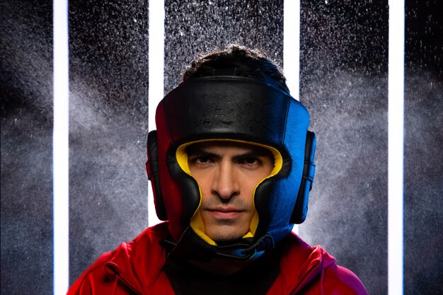 A close-up shot of a League of Legends player, wearing a headset and team jersey adorned with a rainbow patch, focusing intently on the game during a high-stakes esports tournament.