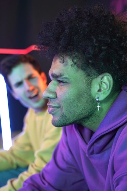A close-up shot of an LGBT League of Legends pro player at their gaming station during a match. The player is focused and determined, with a headset on and hands moving swiftly across the keyboard and mouse. Rainbow lighting accents the gaming setup, symbolizing LGBT pride and support.