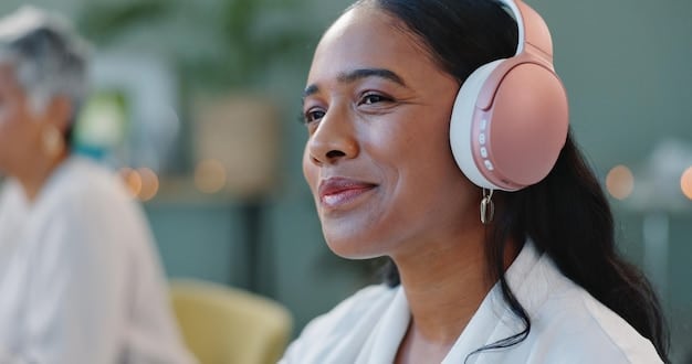 A person wearing a headset is receiving therapy online from a therapist. They both appear to be smiling and nodding, showing resources in the LGBTQ+ community for video game players needing mental health and support.